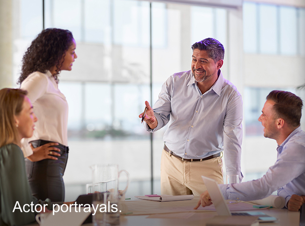 Four people working in an office